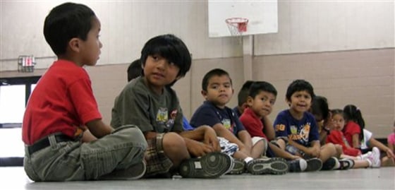 Students sit in the gym at Crossville Elmentary School in Crossville, Ala., on Wednesday, Aug. 17. Despite being in an almost all-white town, the school's enrollment is about 65 percent Hispanic. Both English- and Spanish-speaking residents say they are awaiting the outcome of a federal court hearing on Alabama's new law cracking down on illegal immigration.